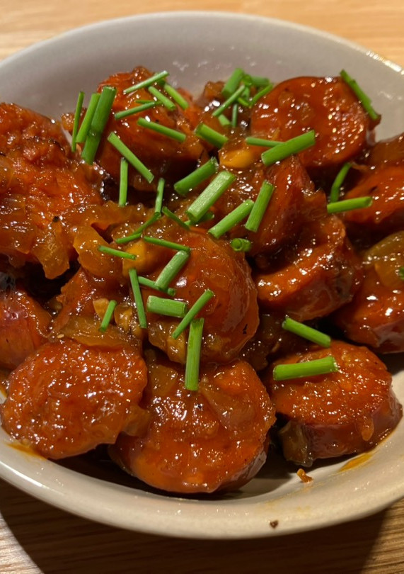 Una foto de Chorizos flambeados con miel y mostaza