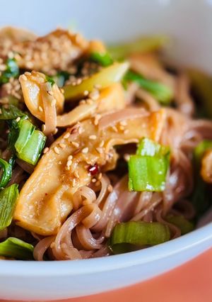 A picture of Stir-Fried Brown Rice Pho with Octopus & Mustard Greens.