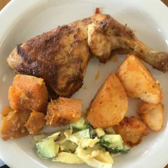 A picture of Grilled chicken with veggies.