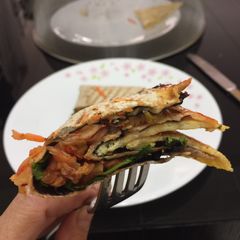 A picture of Kimchi And Feta Cheese Tortilla Wrap.