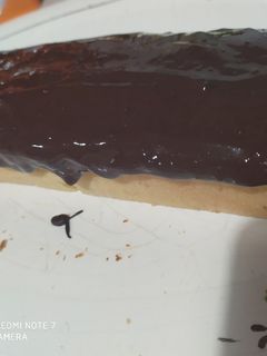 Una foto de Budín de naranja con cobertura de chocolate 😋