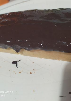 Una foto de Budín de naranja con cobertura de chocolate 😋