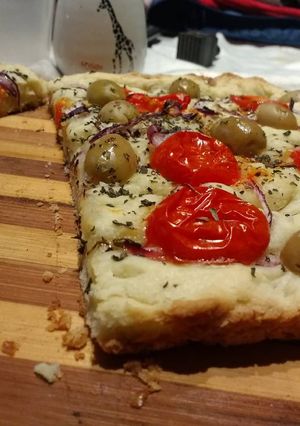 Una foto de Focaccia de tomates y cebollas