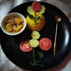 A picture of Basanti pulao with masala paneer and salad.