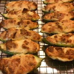 A picture of Three cheese stuffed jalapeno peppers.