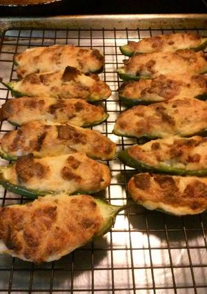 A picture of Three cheese stuffed jalapeno peppers.