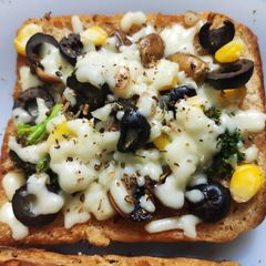 Cheesy Veggie Bread Pizza A picture of Cheesy Veggie Bread Pizza.