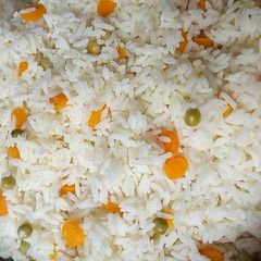 A picture of White rice with veggies.