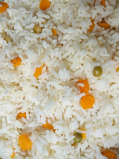 A picture of White rice with veggies.