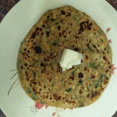 A picture of Methi parantha with paneer stuffing.