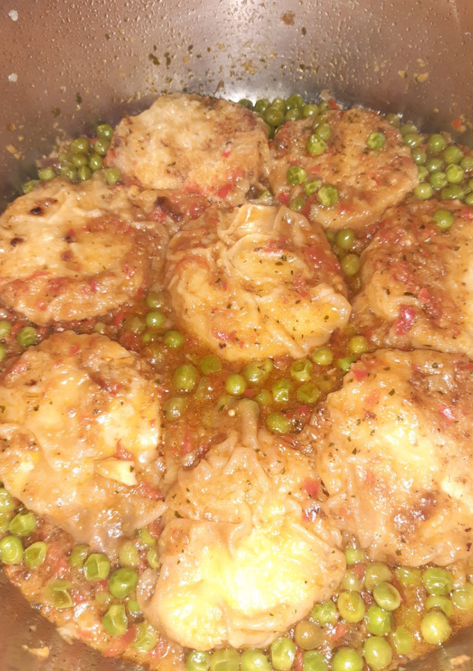 Una foto de Merluza en salsa guisantes