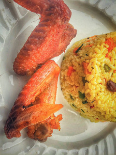 A picture of Fried rice and chicken.
