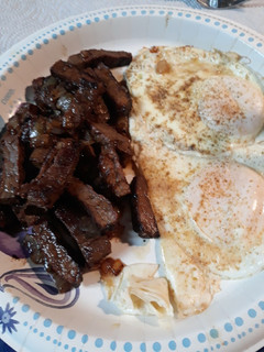 A picture of Steak, Onions, and Eggs.