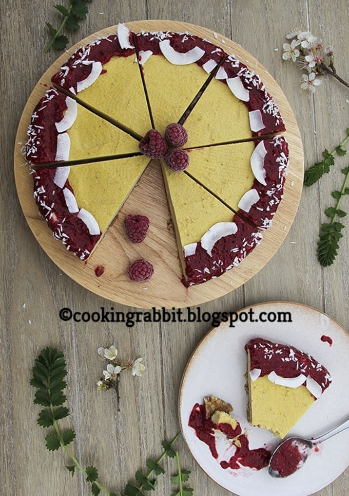 A picture of Mango cake with raspberry sauce.