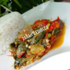 A picture of White Rice and Vegetable sauce.