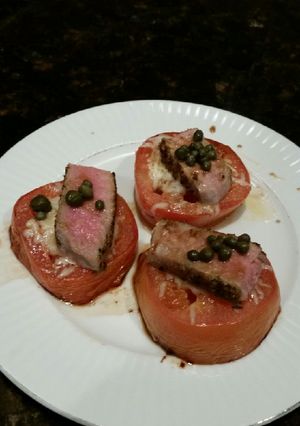 A picture of Brad's cheesey tomatoes with seared ahi tuna and capers.