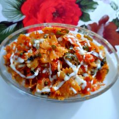 A picture of Farfalle Pasta with cheese & Schezwan sauce.