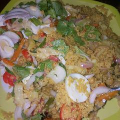 A picture of Veg couscous with salad.