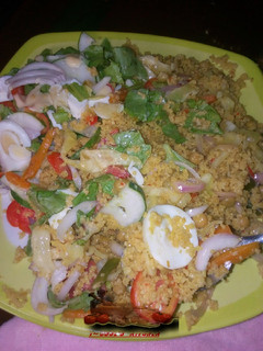 A picture of Veg couscous with salad.