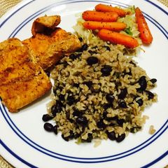 A picture of Cajun Salmon with Black bean Rice & Braised veggies.