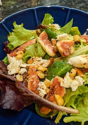 A picture of Figs and mozzarella cheese salad with balsamic dressing.