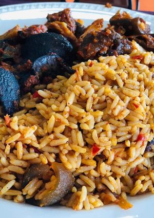 A picture of Jollof rice with snail and pomo.