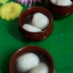 A picture of Rasgullas or Rosogolla (Bangali Spongy Rasgullas) cottage cheese balls soaked in sugar syrup.
