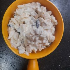 A picture of Date salad with dressing.