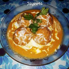 A picture of Chicken Keema Balls with stuffed Cheese in Creamy Gravy.
