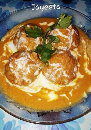 A picture of Chicken Keema Balls with stuffed Cheese in Creamy Gravy.