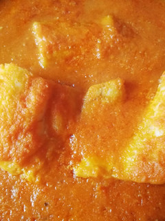 Una foto de Lomos de bacalao con tomate al ajillo