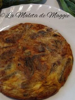 Una foto de Tortilla de alcachofas y jamón