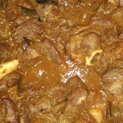 A picture of Mutton curry in pressure cooker.