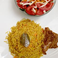 Long grain fried rice with salad A picture of Long grain fried rice with salad.