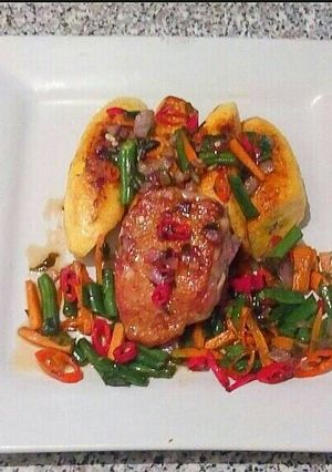 A picture of Bole and chicken veggies stir fry.