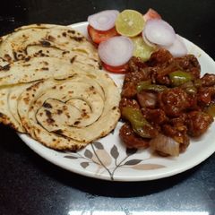 A picture of Chilli Mushroom with Laccha Paratha.