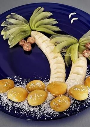 A picture of Salad with raddish kiwi dry chest nuts and fresh dates.