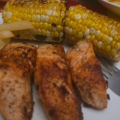 Garlic butter salmon with corn on the cob A picture of Garlic butter salmon with corn on the cob.
