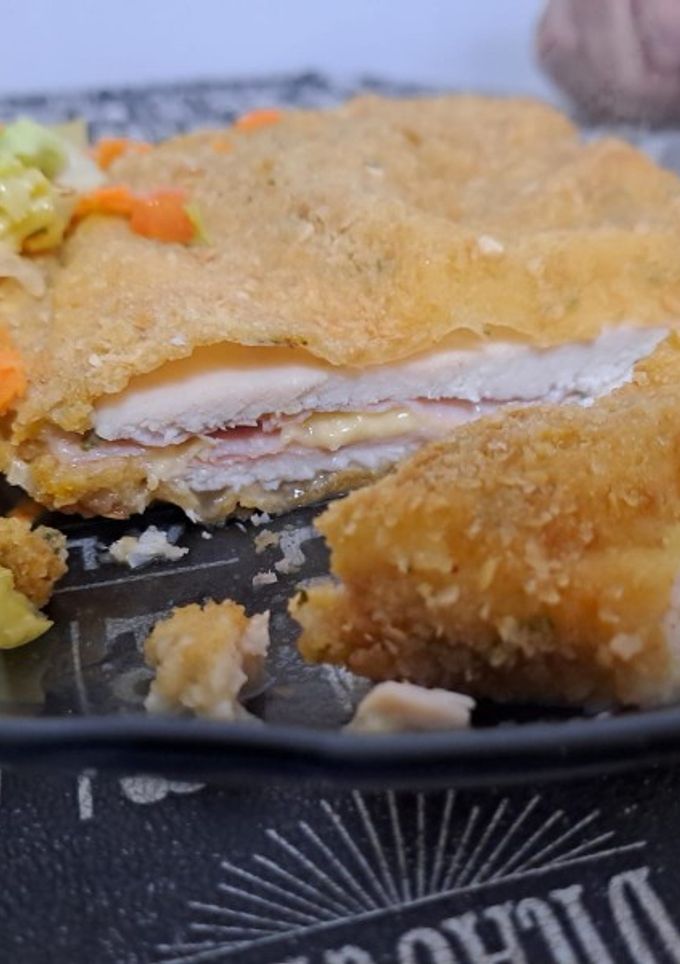 Una foto de Milanesas de pechuga rellenas