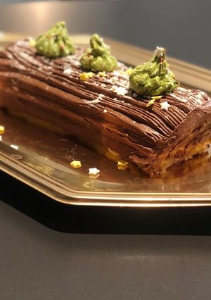 Une photo de Bûche crème pâtissière gd MarnierGanache # team tree 🪵