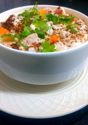 A picture of Onion, tomato, raita.