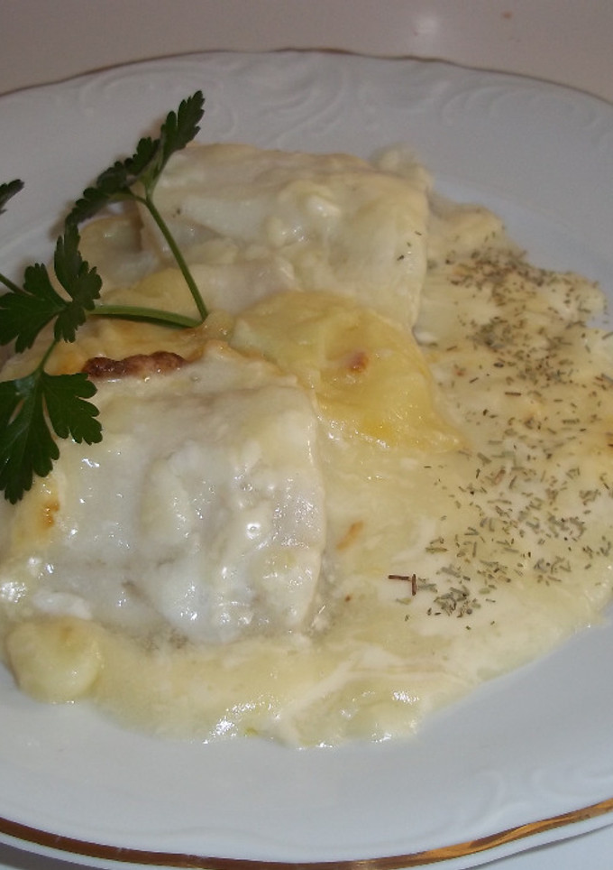 Una foto de Filetes de bacalao congelados con puré de patatas y mayonesa, horneados