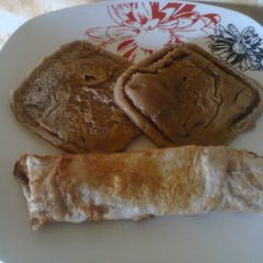 A picture of Choco Semovita Pancake and fried egg wrap.