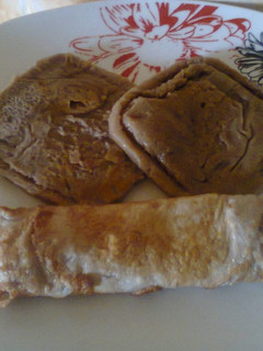 A picture of Choco Semovita Pancake and fried egg wrap.