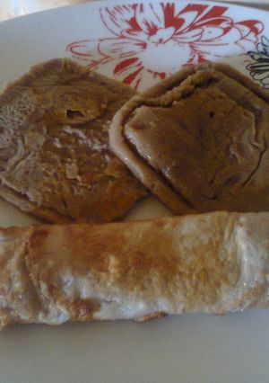 A picture of Choco Semovita Pancake and fried egg wrap.