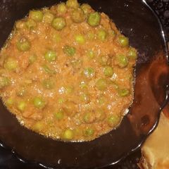 A picture of Garden peas in coconut curry.