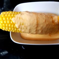 A picture of My Corn on the Cob with homemade Cheese Sauce. 😘.