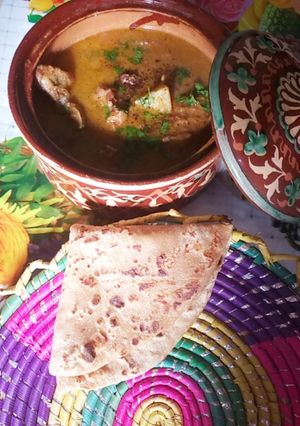 A picture of Aloo gosht with roti.