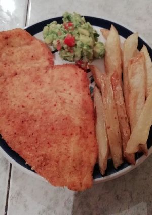 Una foto de Milanesas de pollo con Chile de árbol
