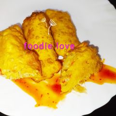 A picture of Mango spring rolls with chilli mango sauce.